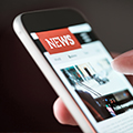 © Adobe Images: Mobile news application in smartphone